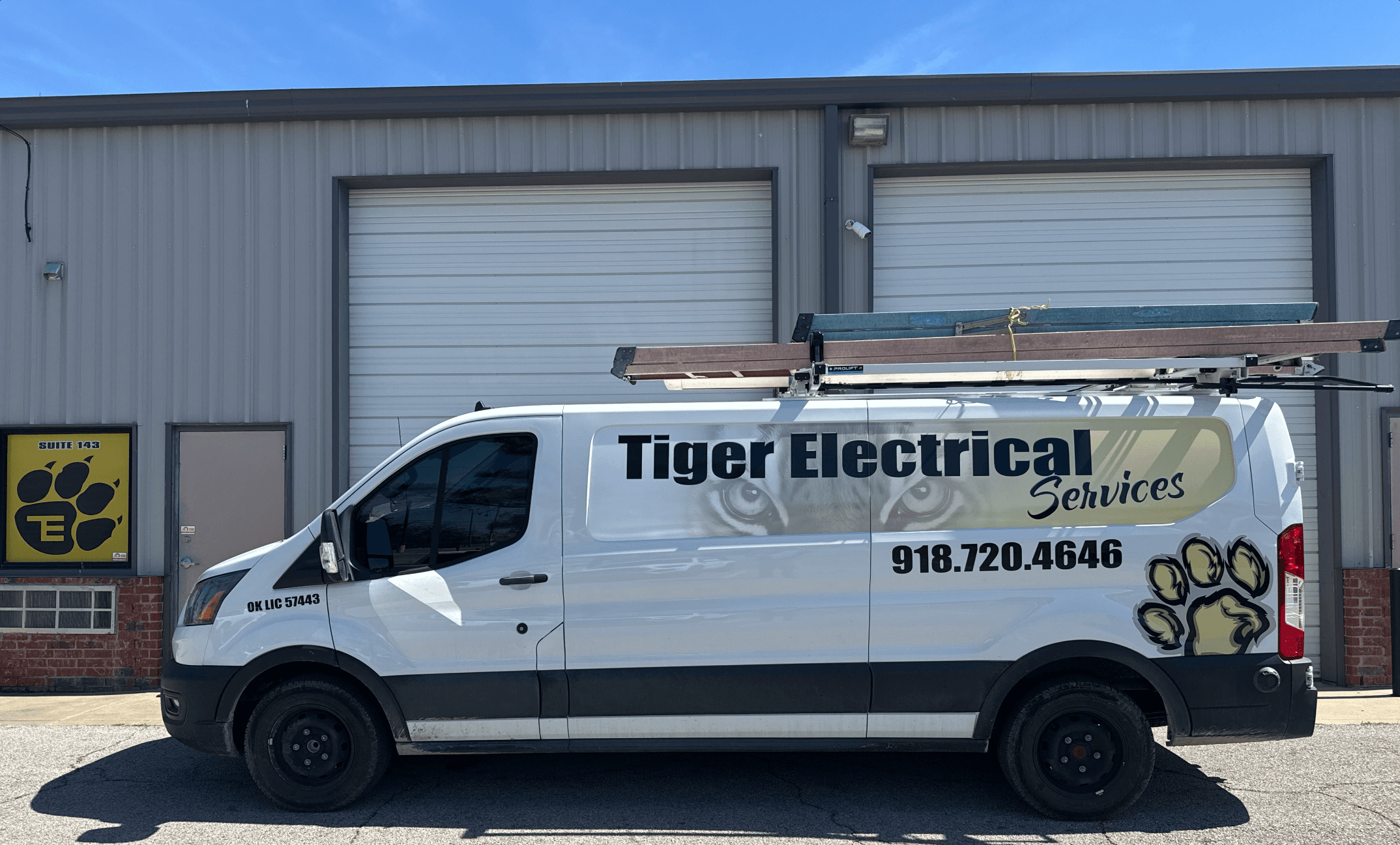 Tiger Electrical work van parked outside the shop — direct communication in action